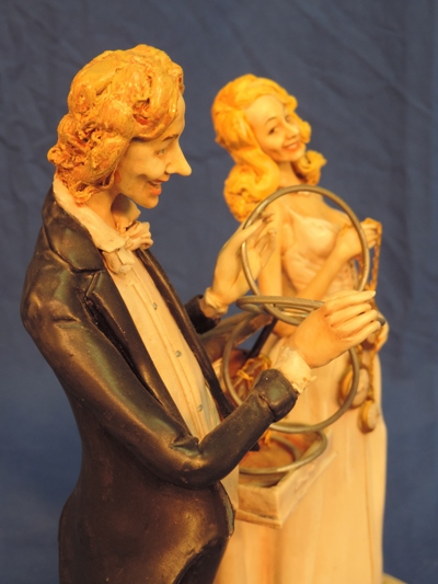 This rare one-of-a-kind statue depicts Richard Ross with Veronique performing his singularly sensational linking ring routine.